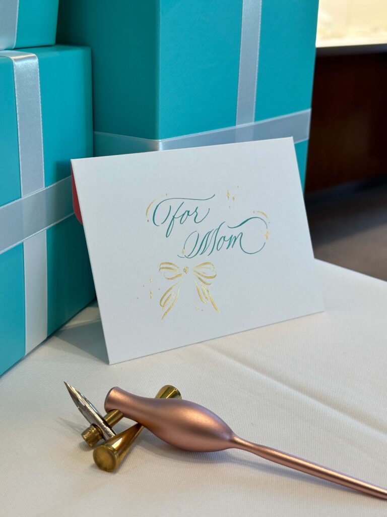 Handwritten calligraphy note card for mom with gold bow illustration