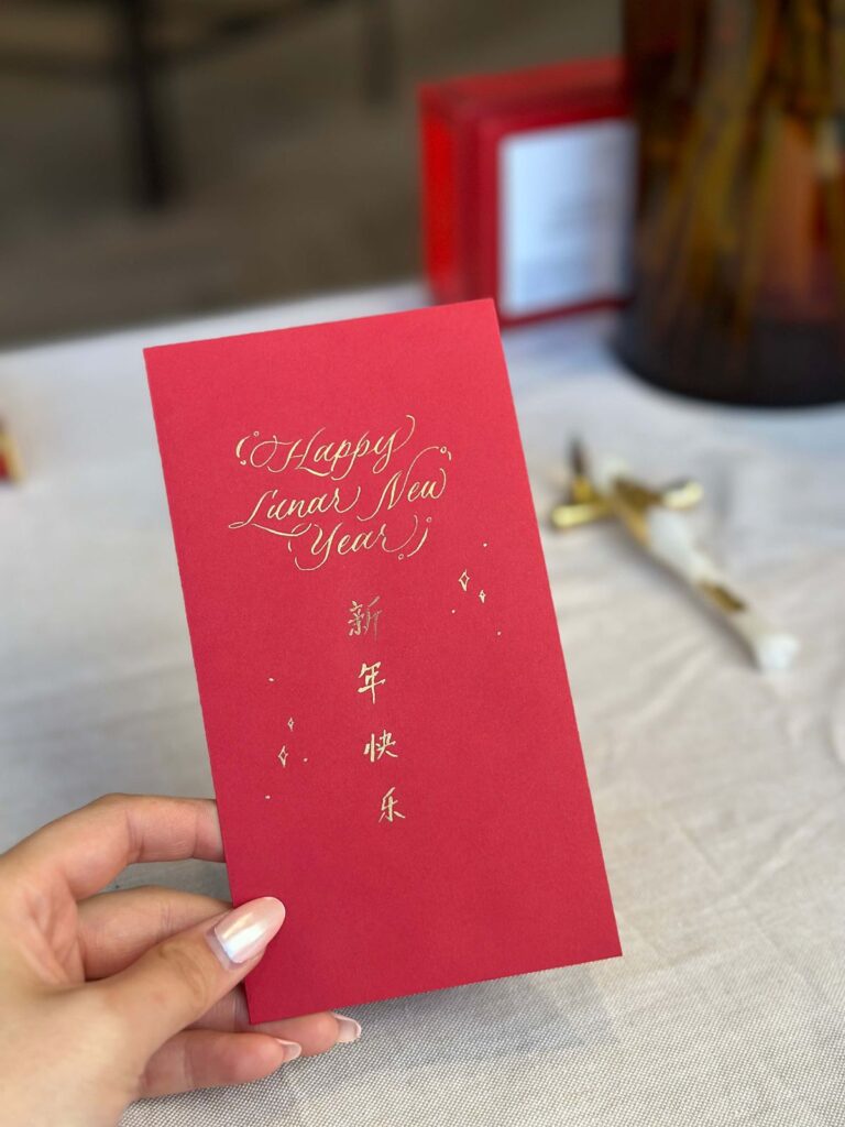 Chinese calligraphy on red envelope in San Francisco