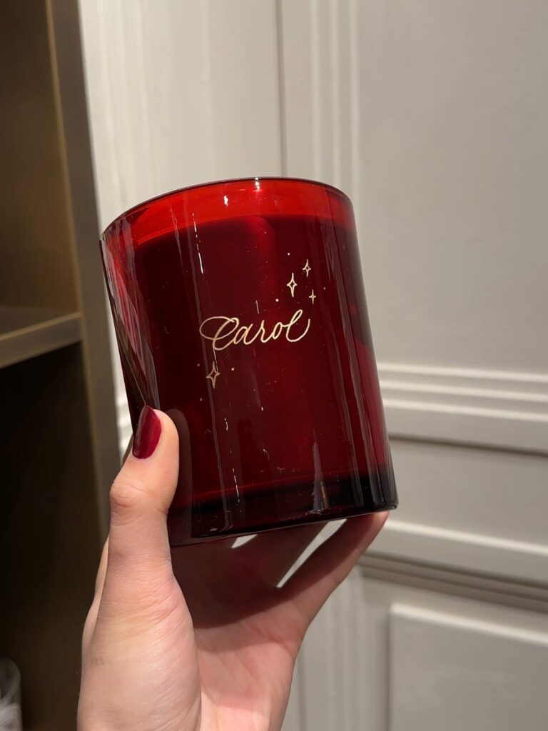 First name with sparkles engraved on a red candle.