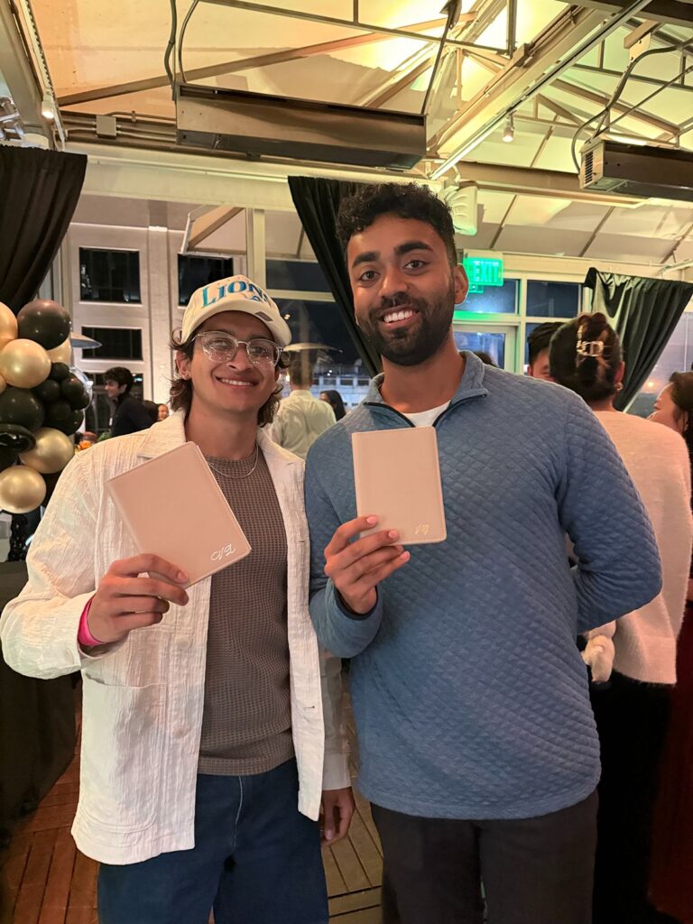 Attendees with their custom leather embossed passport covers.