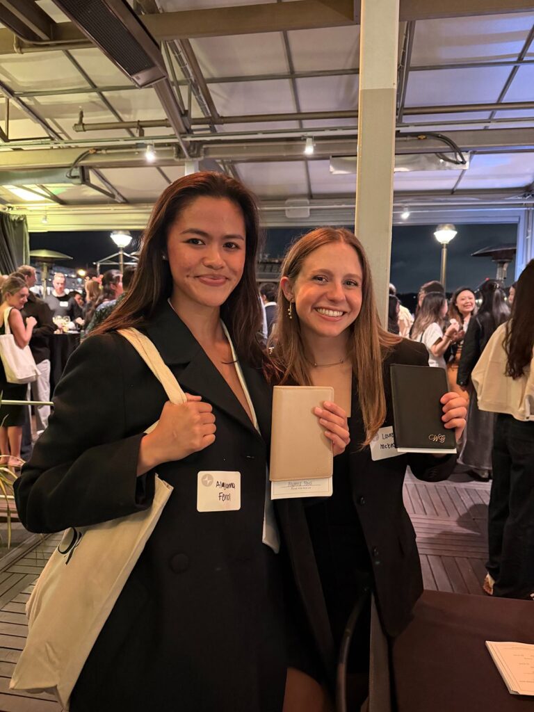 Two girls with their custom embossed leather passport covers.