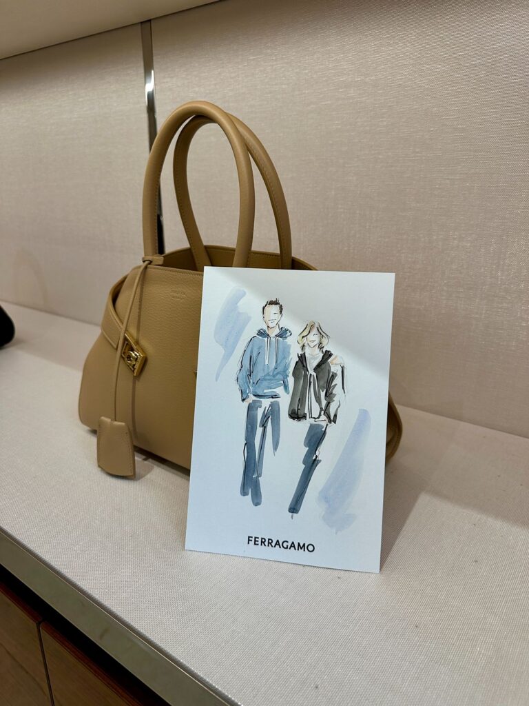 A watercolor fashion illustration of a mother and her son.